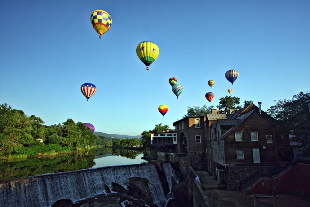 Balloons behind the Simon Pearce Store during the Quechee Balloon Festival in Vermont